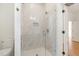 Bright, tiled shower featuring frameless glass, mosaic floor, and modern fixtures providing spa-like experience at 310 W Club Blvd, Durham, NC 27704