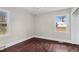 Cozy bedroom featuring hardwood floors and a large window for ample natural light at 311 Nc 56, Louisburg, NC 27549