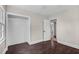 Well-lit bedroom featuring fresh paint, hardwood floors and ample closet space at 311 Nc 56, Louisburg, NC 27549