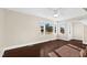 Bright and airy living room with beautiful hardwood floors, large windows, and neutral paint color at 311 Nc 56, Louisburg, NC 27549