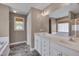 Bathroom with double sink vanity, soaking tub, and neutral tones at 3315 Swinford Ct, Raleigh, NC 27604