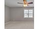 Secondary bedroom with a ceiling fan, window, and neutral carpet at 3315 Swinford Ct, Raleigh, NC 27604