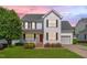 Charming two-story home with a well-manicured lawn, inviting porch, and a classic design at 3315 Swinford Ct, Raleigh, NC 27604