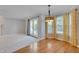 Open living space with hardwood floors, leading to living room with plush carpet at 3315 Swinford Ct, Raleigh, NC 27604