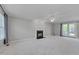 Spacious living room featuring plush carpet, fireplace, and access to the backyard at 3315 Swinford Ct, Raleigh, NC 27604