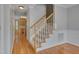 View of staircase and hardwood floors as you enter the house at 3315 Swinford Ct, Raleigh, NC 27604