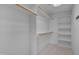 Spacious walk-in closet with shelving and wooden rails for organized storage at 3315 Swinford Ct, Raleigh, NC 27604