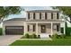 Charming two-story home featuring a covered front porch, a two car garage and manicured landscaping at 337 Green Pines Estates Dr, Kenly, NC 27542