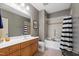 Bathroom featuring a vanity, framed mirror, tiled shower, and modern fixtures at 340 Allister Dr # 201, Raleigh, NC 27609
