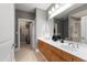 Bathroom boasting double sinks, wood cabinetry, and walk-in closet access at 340 Allister Dr # 201, Raleigh, NC 27609