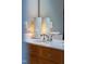 Bright bathroom sink featuring chrome fixtures and decorative lamps at 340 Allister Dr # 201, Raleigh, NC 27609