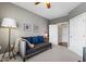 Bedroom with a daybed, throw blanket, decor, neutral colors, and access to the hallway at 340 Allister Dr # 201, Raleigh, NC 27609