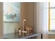 Desk space featuring a modern lamp, artwork, and natural light from the nearby window at 340 Allister Dr # 201, Raleigh, NC 27609