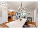 Open-concept view of dining room flowing into the kitchen and living room area at 340 Allister Dr # 201, Raleigh, NC 27609