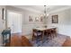 Bright dining room featuring wainscoting and a modern chandelier at 340 Allister Dr # 201, Raleigh, NC 27609