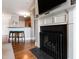 Close-up view of the living room fireplace with white mantel and black fire screen at 340 Allister Dr # 201, Raleigh, NC 27609