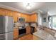 Well-equipped kitchen featuring stainless steel appliances, light-colored cabinets, and granite countertops at 340 Allister Dr # 201, Raleigh, NC 27609