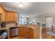 Open concept kitchen with granite counters, stainless appliances and easy access to living spaces at 340 Allister Dr # 201, Raleigh, NC 27609