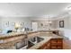 Open kitchen showcasing granite counters, stainless steel sink, and views into the living and dining areas at 340 Allister Dr # 201, Raleigh, NC 27609