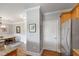 Open floor plan kitchen with stainless steel refrigerator, granite countertops, and dining area at 340 Allister Dr # 201, Raleigh, NC 27609