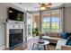 Cozy living room featuring a fireplace, balcony access, and comfortable seating at 340 Allister Dr # 201, Raleigh, NC 27609