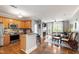 Spacious living room with hardwood floors, fireplace, and access to a balcony at 340 Allister Dr # 201, Raleigh, NC 27609