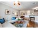 Inviting living room with kitchen view, dining area, comfortable sofa, and stylish decor at 340 Allister Dr # 201, Raleigh, NC 27609