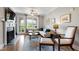 Comfortable living room with fireplace, French doors to balcony, and hardwood floors at 340 Allister Dr # 201, Raleigh, NC 27609