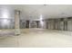Spacious parking garage with concrete walls, large support beam, and painted parking spaces at 340 Allister Dr # 201, Raleigh, NC 27609