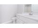 Bright bathroom features a white single sink vanity, toilet, and shower at 3601 Sugar Tree Pl, Durham, NC 27713