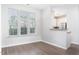 Bright living room with wood floors and large windows overlooking the neighborhood at 3601 Sugar Tree Pl, Durham, NC 27713