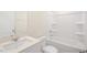 A clean bathroom featuring a shower-tub combo, toilet, and white vanity with sink at 3604 Sorda Ct, Raleigh, NC 27610