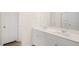 Bathroom with double sink vanity and large mirror, as well as a view into the water closet at 3604 Sorda Ct, Raleigh, NC 27610