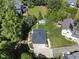 Aerial view showcases a beautifully landscaped property, swimming pool, and serene surroundings at 3617 Carlow Ct, Raleigh, NC 27612