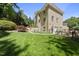 Expansive green backyard with manicured lawn and lush greenery; ideal for outdoor activities at 3617 Carlow Ct, Raleigh, NC 27612