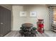 Finished basement area with checker table, seating, and a popcorn machine at 3617 Carlow Ct, Raleigh, NC 27612