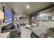Finished basement featuring grey couches, recessed lighting, and modern geometric artwork at 3617 Carlow Ct, Raleigh, NC 27612