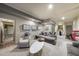 Finished basement featuring grey couches, recessed lighting, and modern geometric artwork at 3617 Carlow Ct, Raleigh, NC 27612