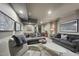 Finished basement featuring grey couches, recessed lighting, and modern geometric artwork at 3617 Carlow Ct, Raleigh, NC 27612
