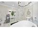 Beautiful bathroom with soaking tub, glass enclosed shower, dual sinks, and modern lighting at 3617 Carlow Ct, Raleigh, NC 27612