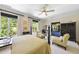 Spacious and stylish bedroom featuring sitting area and large windows with beautiful backyard views at 3617 Carlow Ct, Raleigh, NC 27612