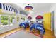 Shared bedroom with car-themed decor, twin beds, and bright, natural light at 3617 Carlow Ct, Raleigh, NC 27612