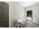 Cute dining area off kitchen with white table and chairs, leading to backyard at 3617 Carlow Ct, Raleigh, NC 27612