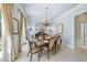 Elegant dining room with a chandelier and views to the backyard creates an inviting space for meals and gatherings at 3617 Carlow Ct, Raleigh, NC 27612