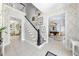 Bright entryway showcases a staircase and entryways into other living spaces, complemented by neutral tones and stylish décor at 3617 Carlow Ct, Raleigh, NC 27612