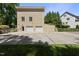Rear view of the house with a spacious driveway and attached two-car garage at 3617 Carlow Ct, Raleigh, NC 27612