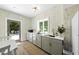 Cozy kitchen with sleek countertops, modern gray cabinets, and backyard view at 3617 Carlow Ct, Raleigh, NC 27612