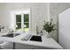 Close up on bright countertops, stainless steel faucet, and minimalist decor at 3617 Carlow Ct, Raleigh, NC 27612