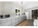 Charming kitchen with gray cabinets, modern appliances, and a view to the backyard at 3617 Carlow Ct, Raleigh, NC 27612
