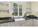 Charming kitchen sink with a large window and views of the outdoors at 3617 Carlow Ct, Raleigh, NC 27612